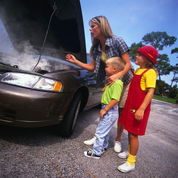 Woman broken down in need of roadside service.